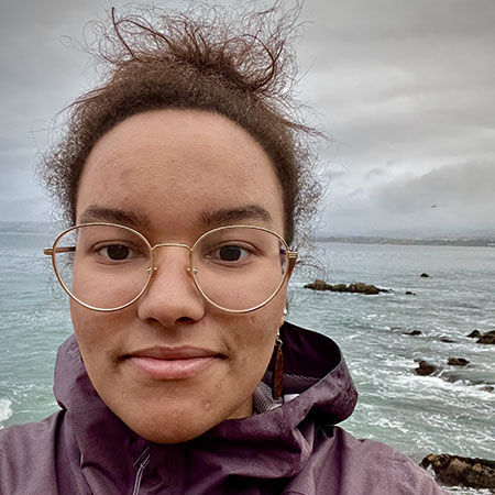 Christina-Cherop-Stuhl-crop.jpg Christina with ocean and rocks in background