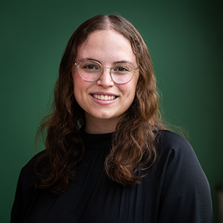 Samantha-Jerry-crop.png Samantha in front of forest green background